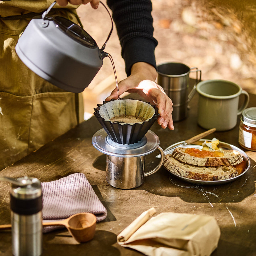 Black Origami Air S plastic coffee dripper for pour-over brewing, featuring a compact, foldable design for easy use.